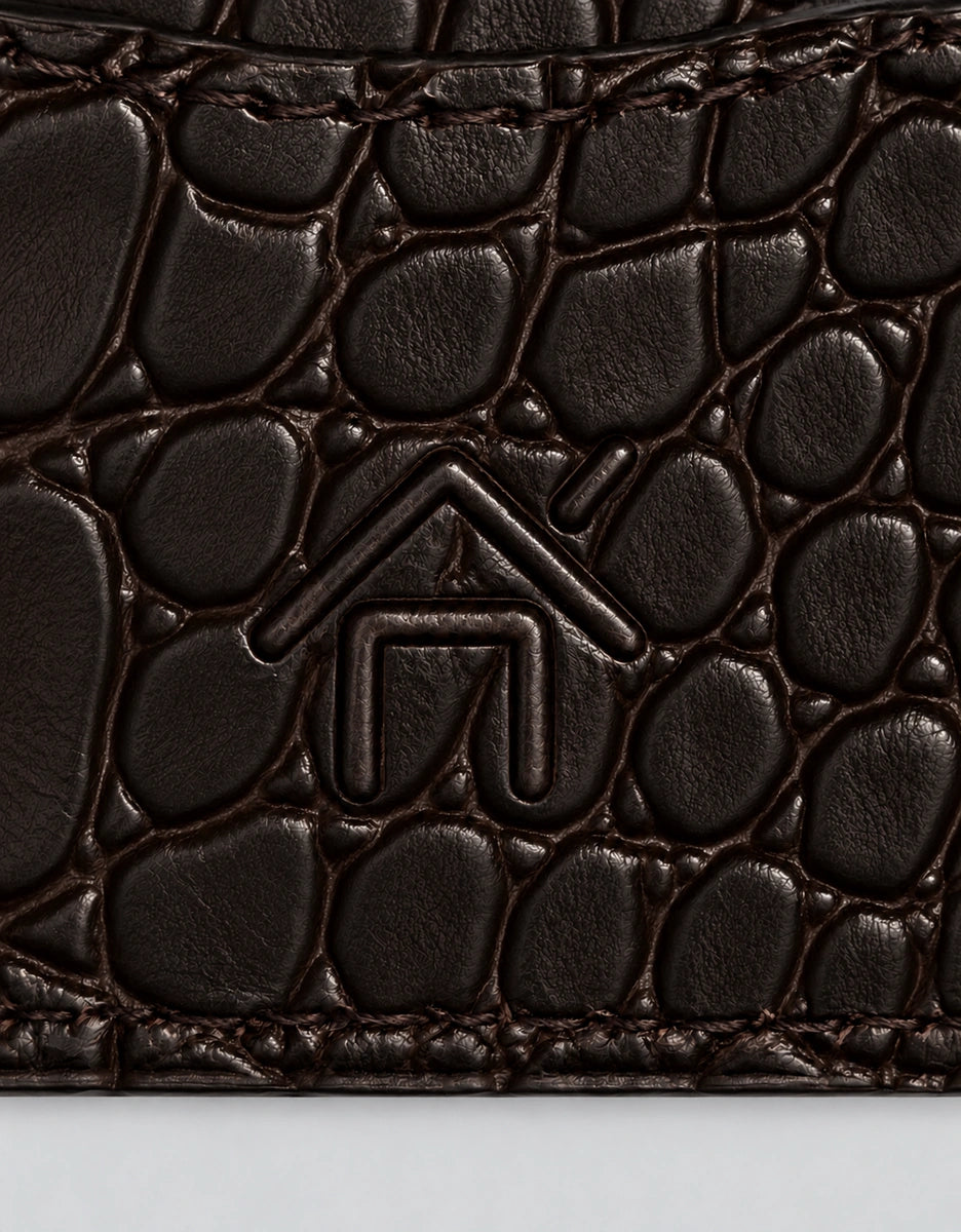 House emblem on the textured reverse of the card holder.