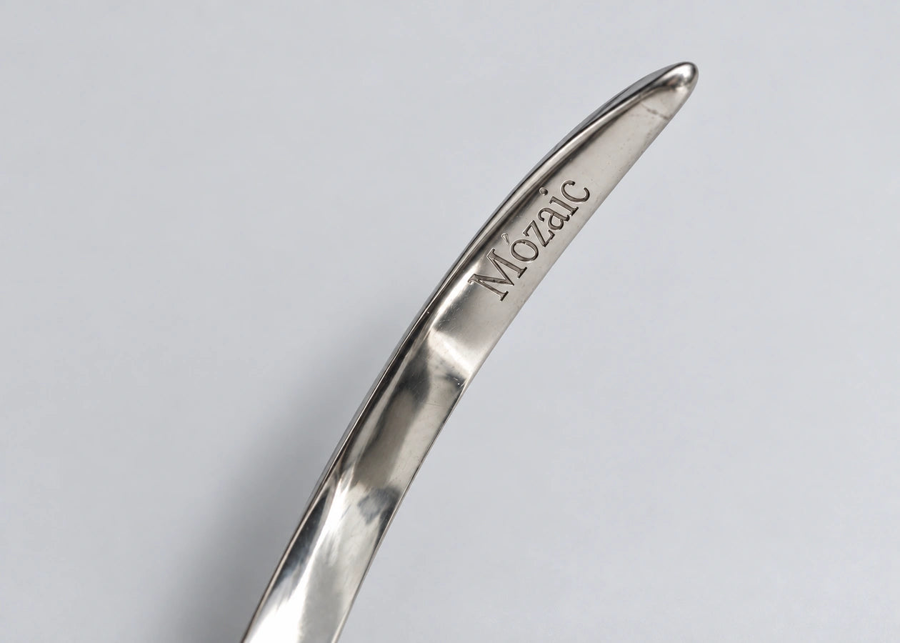 Mózaic wordmark engraved on the silver cuff.