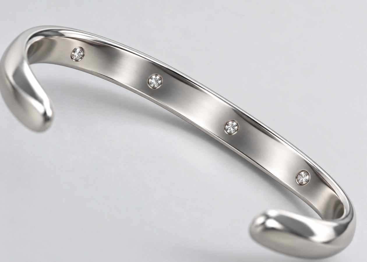 Four stones set along the inner face of the silver cuff.